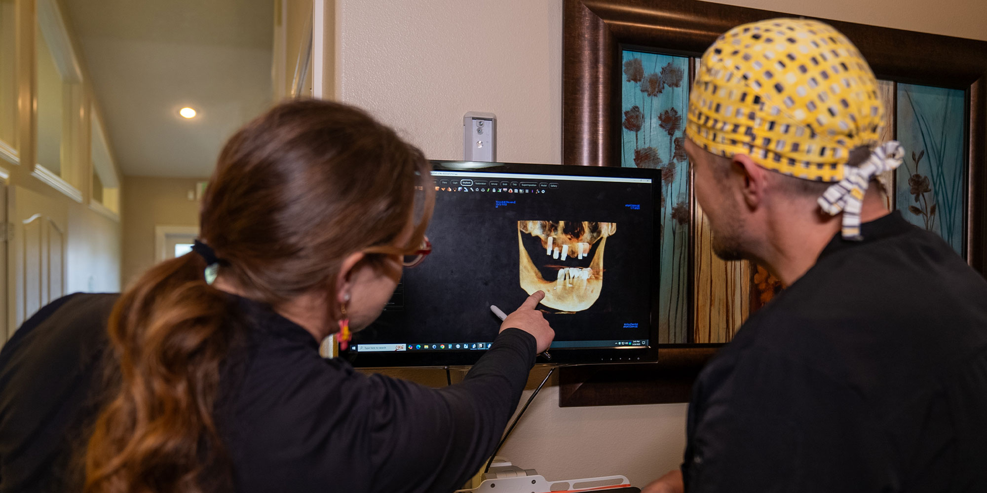 doctor and team member going over a patient's x-ray