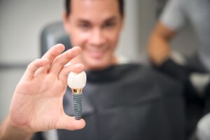 Dentist explaining dental implants to a patient in a modern office